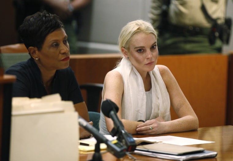 Image: Lindsay Lohan sits during a progress report hearing at Airport Branch Courthouse in Los Angeles